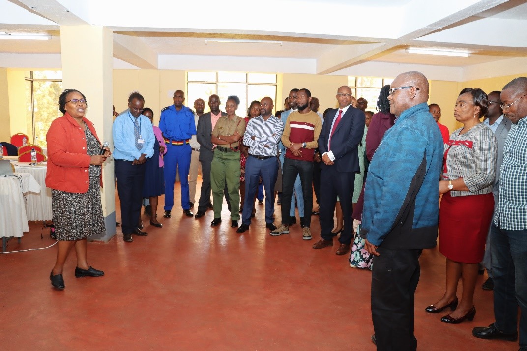 Jane Thiomi (far left), Associate Director of HIV Prevention and GBV, LVCT Health, addressing the Kerugoya Court Users Committee on types of violence during the training